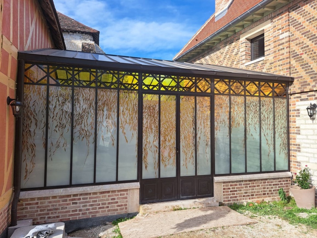 Verrière créant un lien entre habitat et grange