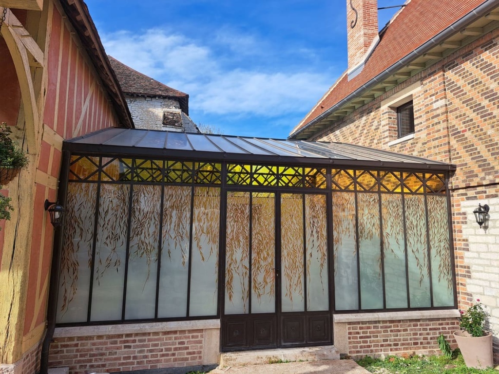 Verrière créant un lien entre habitat et grange